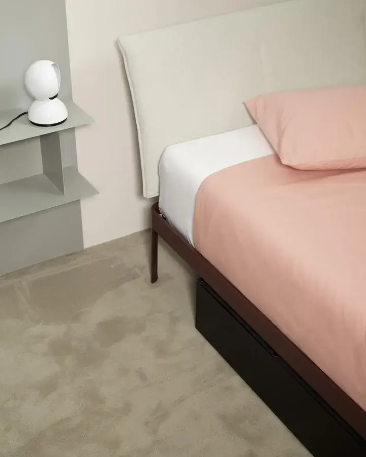 Polished Kristalia AluAlu bed with reddish-brown powder-coated aluminum, off-white upholstered headboard and black melamine