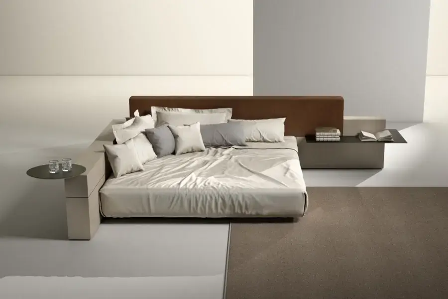 Exquisite Laurameroni Symphony bed with warm brown leather headboard, light beige matte wood frame and black aniline base