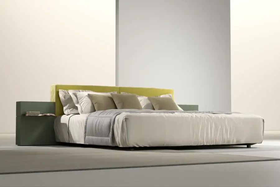 Sumptuous Laurameroni Symphony bed with muted yellowish-green velvet headboard and matte black aniline-dyed wood frame