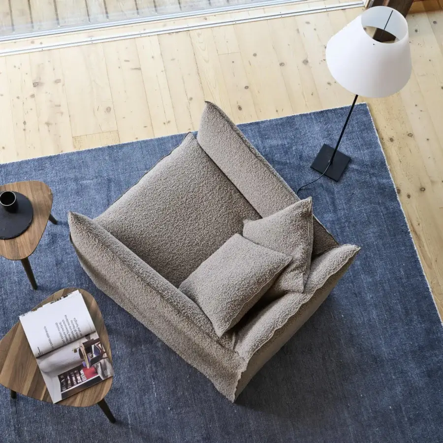 Luxury Gervasoni Ghost lounge chair in neutral taupe with textured textile cover and backrest cushions filled Dacron down