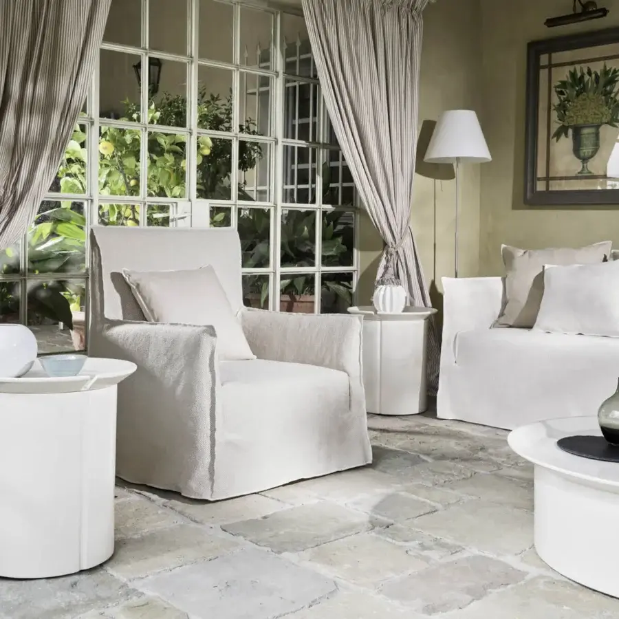 Luxury Gervasoni Ghost lounge chair with light‑off‑white textile cover, polyurethane foam frame, Dacron‑down cushions, removable oversized pattern, Italian craftsmanship.