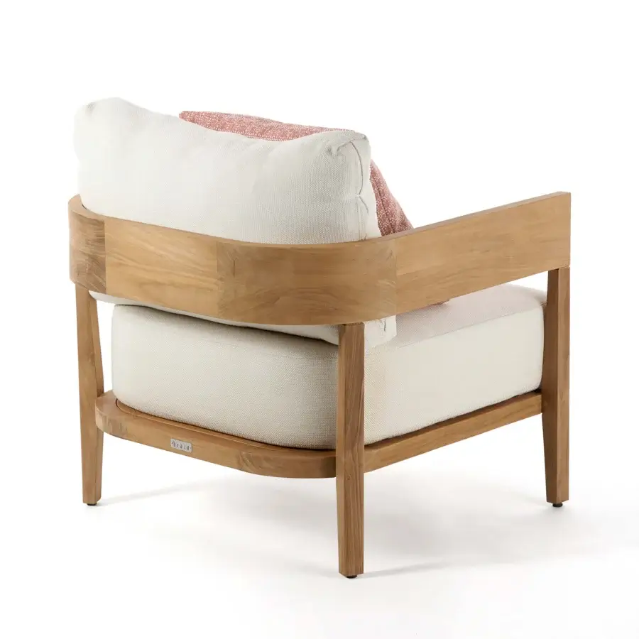 Exquisite Braid Feeling lounge chair with off-white cushions and reddish-orange patterned pillow in natural wood tone teak