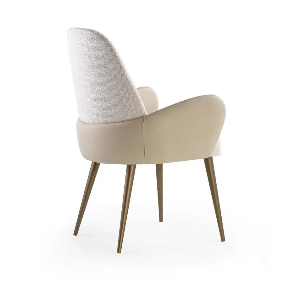 Superior Reflex Atlantic chair with curved white textured fabric upholstery and bronze toned tapered legs