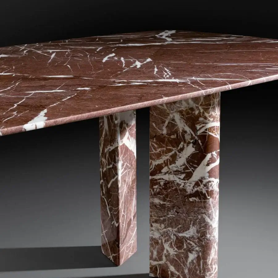Distinguished Bonaldo Geometric table with deep red marble top and uniquely shaped legs displaying white veining and polished finish