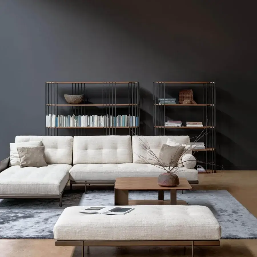 Refined Bonaldo Maximilian sectional with light cream textured textile and matt varnished metal base and feet