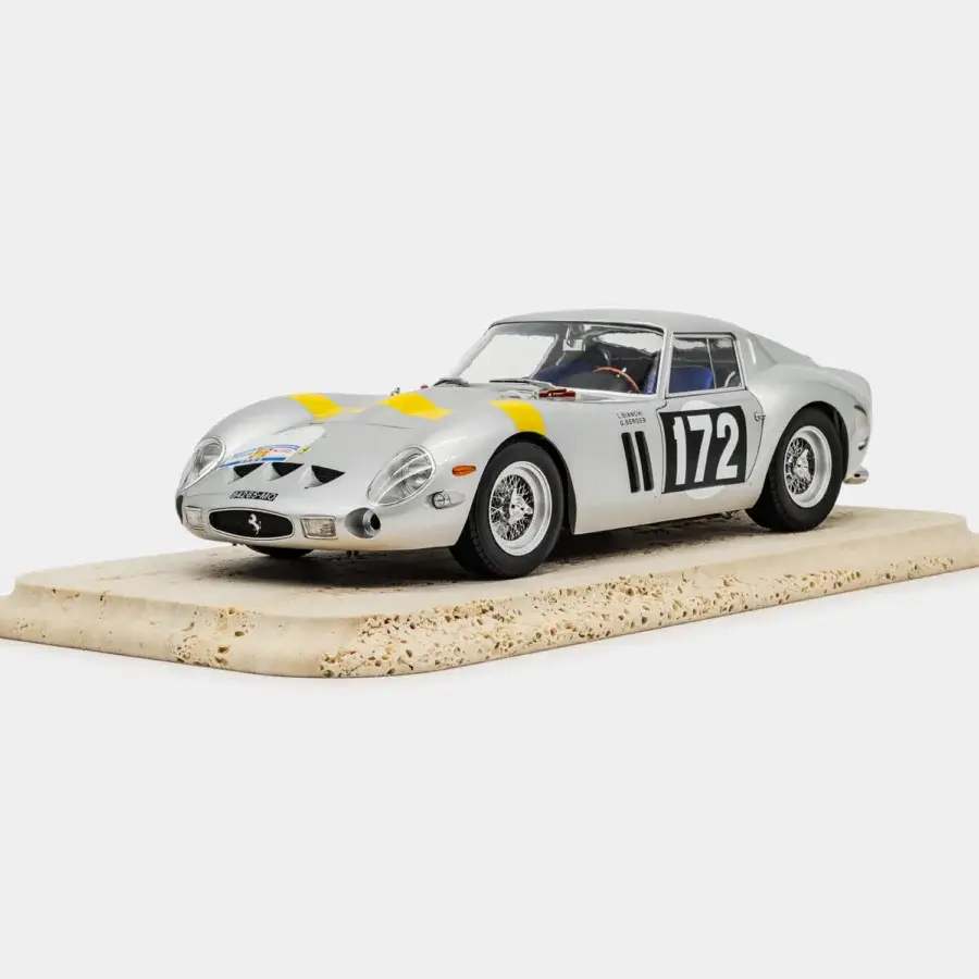 Distinguished Vèlle Milano Ferrari 250GTO Tour de France design object in glossy silver metal with Modena yellow stripe on marble