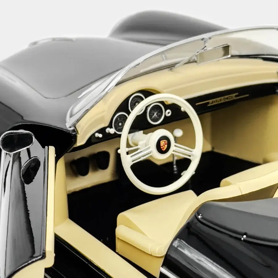Distinguished Vèlle Milano Porsche 356 A Speedster model in glossy black metal with beige interior and natural marble base
