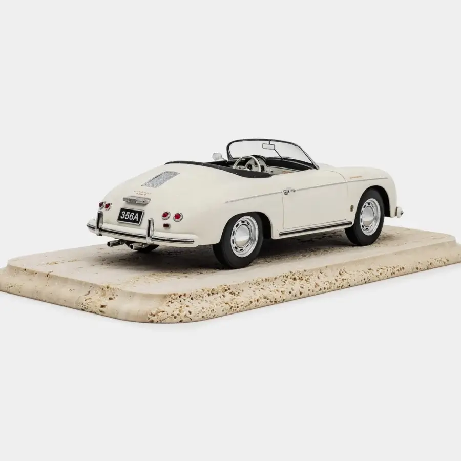 Sophisticated Vèlle Milano Porsche 356 A Speedster scale model in glossy ivory metal with silver accents and beige marble