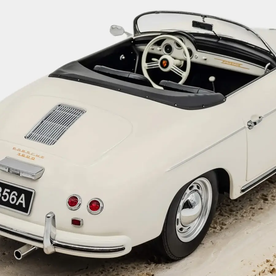 Remarkable Vèlle Milano Porsche 356 A Speedster model in glossy ivory metal with natural marble base and polished chrome
