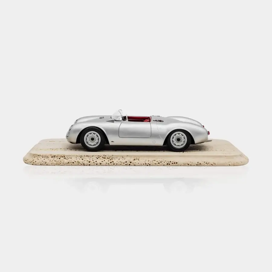 Superior Vèlle Milano Porsche 550A Spyder model in glossy metallic silver with burgundy interior and natural marble base