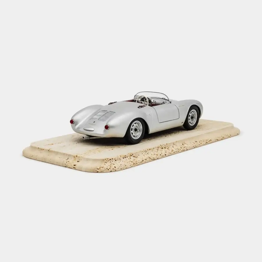 Exquisite Vèlle Milano Porsche 550A Spyder model crafted from silver metal with burgundy interior and natural marble base