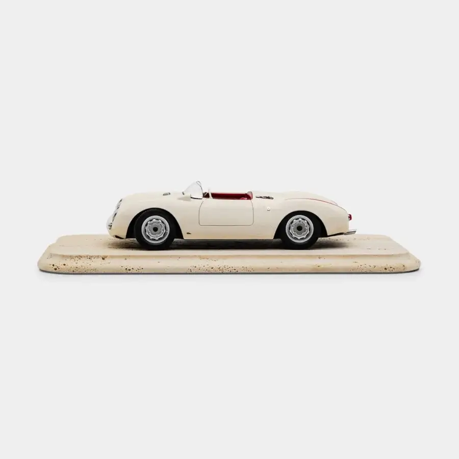 Exquisite Vèlle Milano Porsche 550A Spyder model in glossy off-white metal with burgundy interior and natural marble base