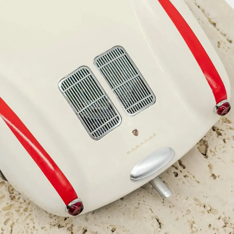 Exquisite Vèlle Milano Porsche 550A Spyder model crafted in high-gloss white metal with red stripes and natural marble base
