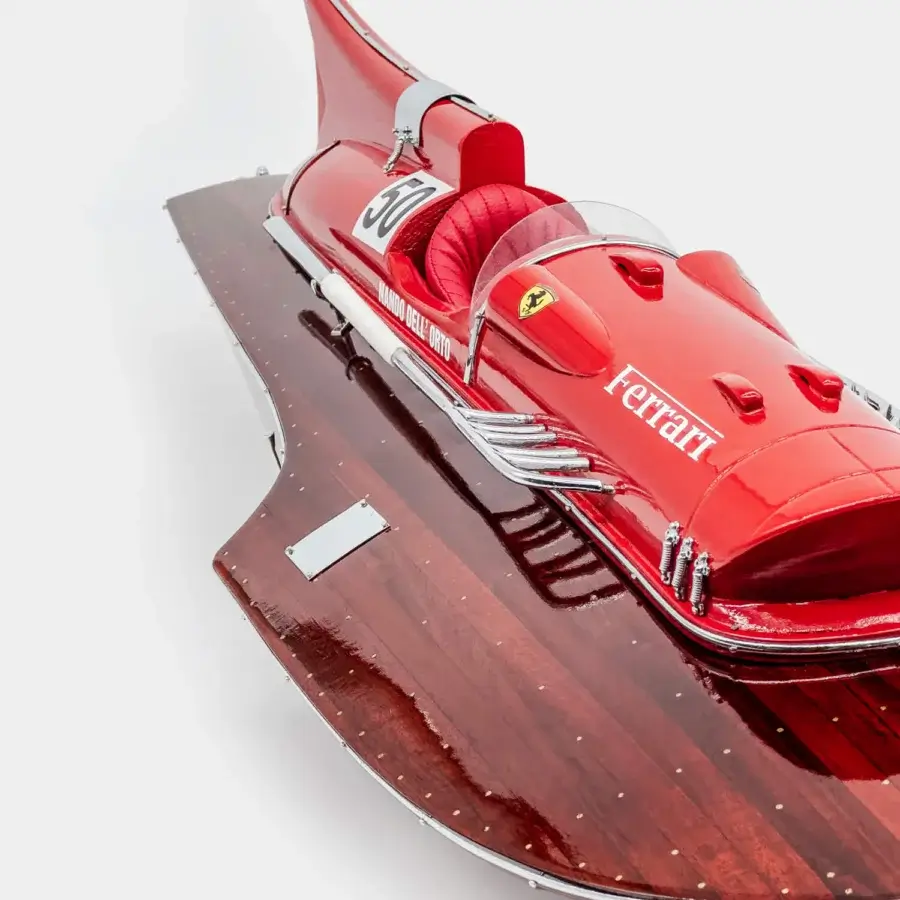 Sleek Vèlle Milano Ferrari Arno XI Hydroplane centerpiece in red quilted leather and polished mahogany high-gloss finish