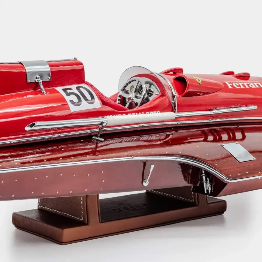 Exquisite Vèlle Milano Ferrari Arno XI hydroplane reproduction in high-gloss red mahogany with metal and brown leather base