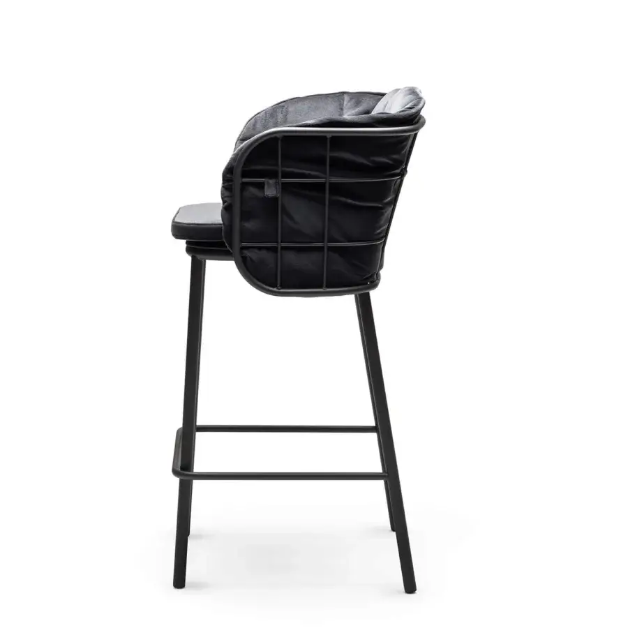 Refined Chairs & More Jujube stool in monochromatic black powder-coated metal with lattice backrest and footrest rail