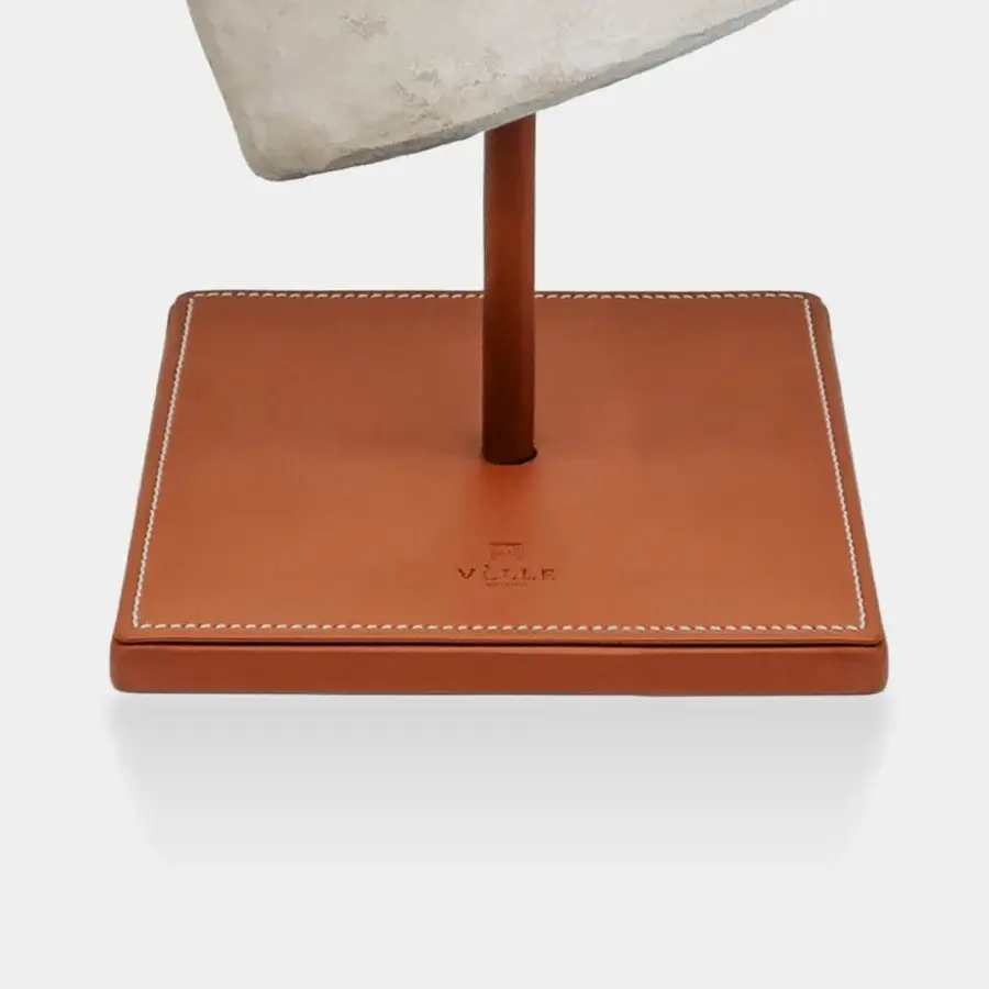 Impeccable Vèlle Milano Aphrodite sculpture in off-white aged-effect plaster with tan leather-wrapped powder-coated steel base