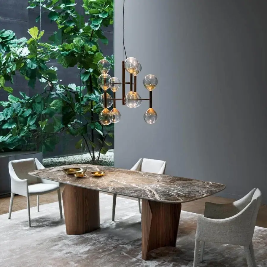 Elegant Bonaldo Flame table with swirling browns, grays, and creams resembling marble atop a satin finish wooden base
