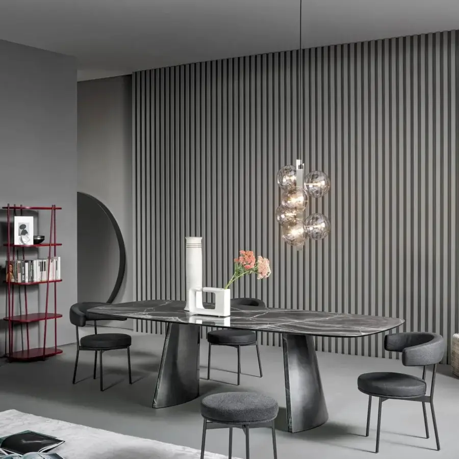 Elegant Bonaldo Torii table with oval top crafted from ceramic displaying grey veining and matching metal base finish