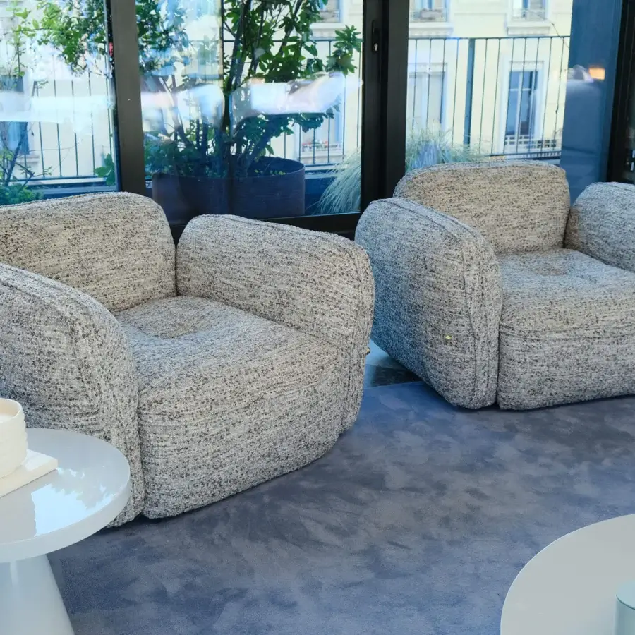Sophisticated Furla Casa Moonstone lounge chair in light grey speckled textured textile with black beech wood feet