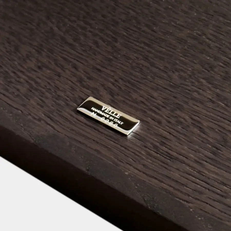 Sophisticated Vèlle Milano Aliseo side table in deep dark brown solid wood with X-frame and brushed brass detailing