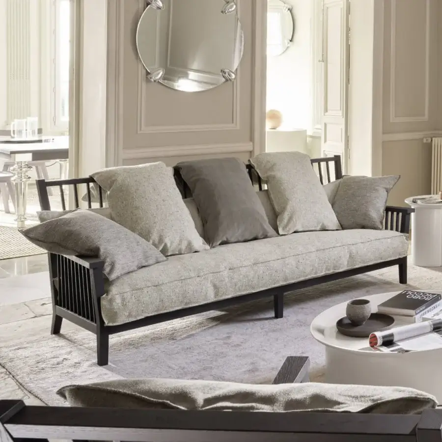 Refined Gervasoni Gray 03 sofa with textured cushions and low-profile matte black ash wood slatted frame