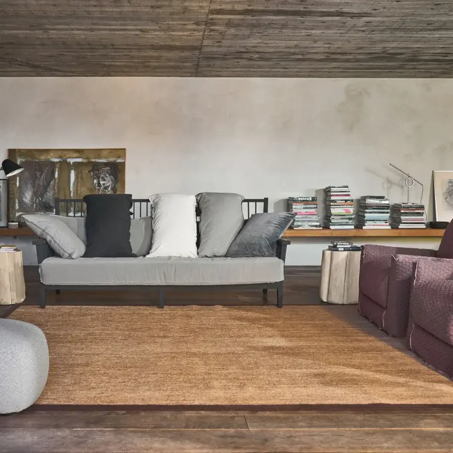 Sophisticated Gervasoni Gray 03 sofa crafted from light textile and charcoal white cushions in dark-finished ash wood frame