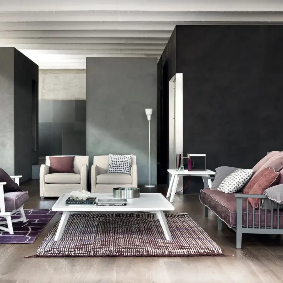 Impeccable Gervasoni Gray 03 sofa with plush dusty pink textile cushions and matte architectural ash wood frame