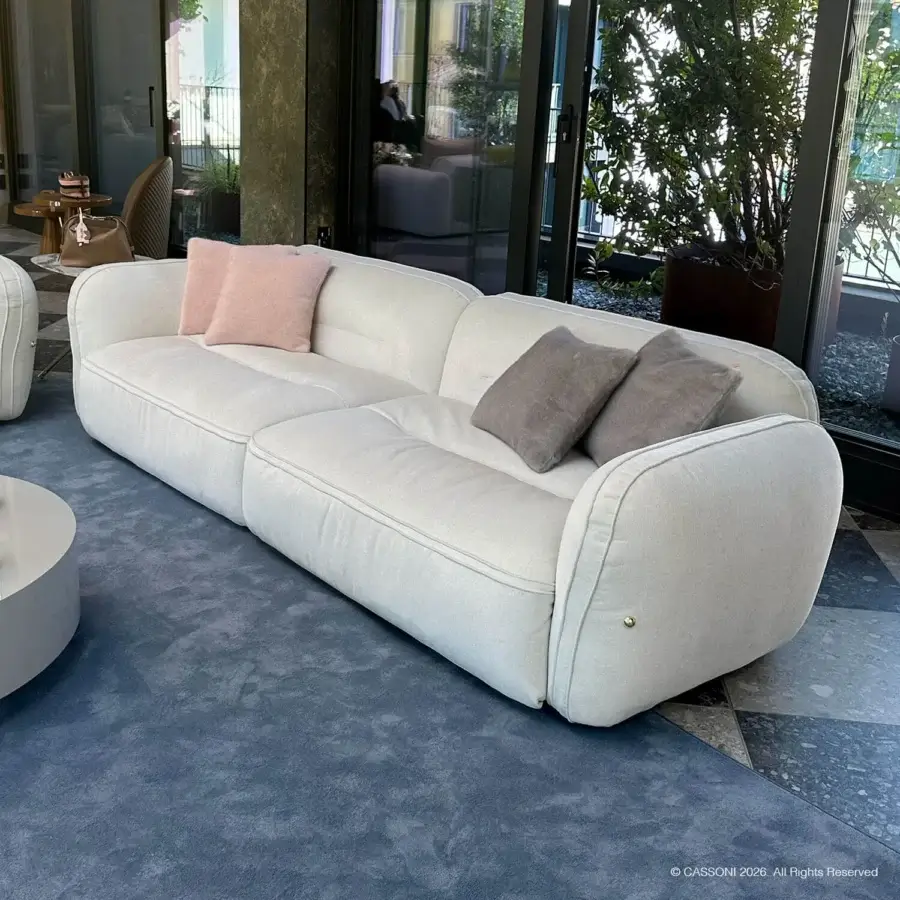 Sophisticated Furla Casa Moonstone sofa in cream textile with low profile organic silhouette and black beech wood feet