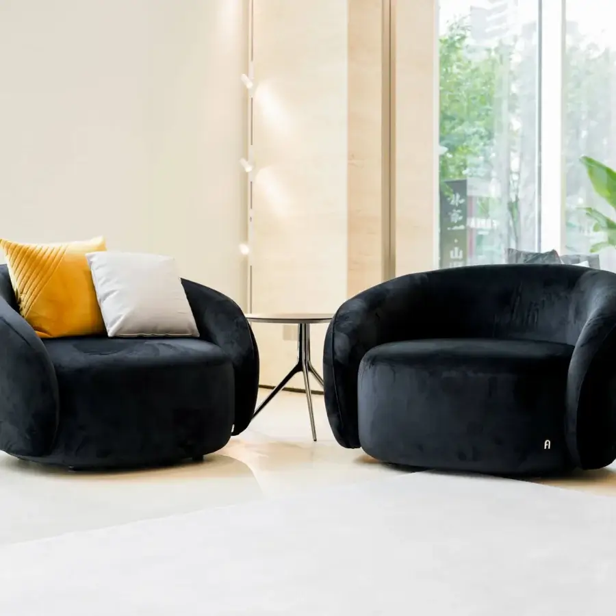 Distinguished Furla Casa Opportunity lounge chair in black fabric with matte plush finish and rounded organic silhouette