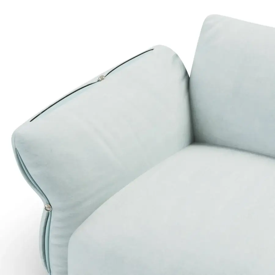 Sophisticated Furla Casa Cherry Blossom sofa in pale light blue textile with rounded silhouette, dark piping and metal logos