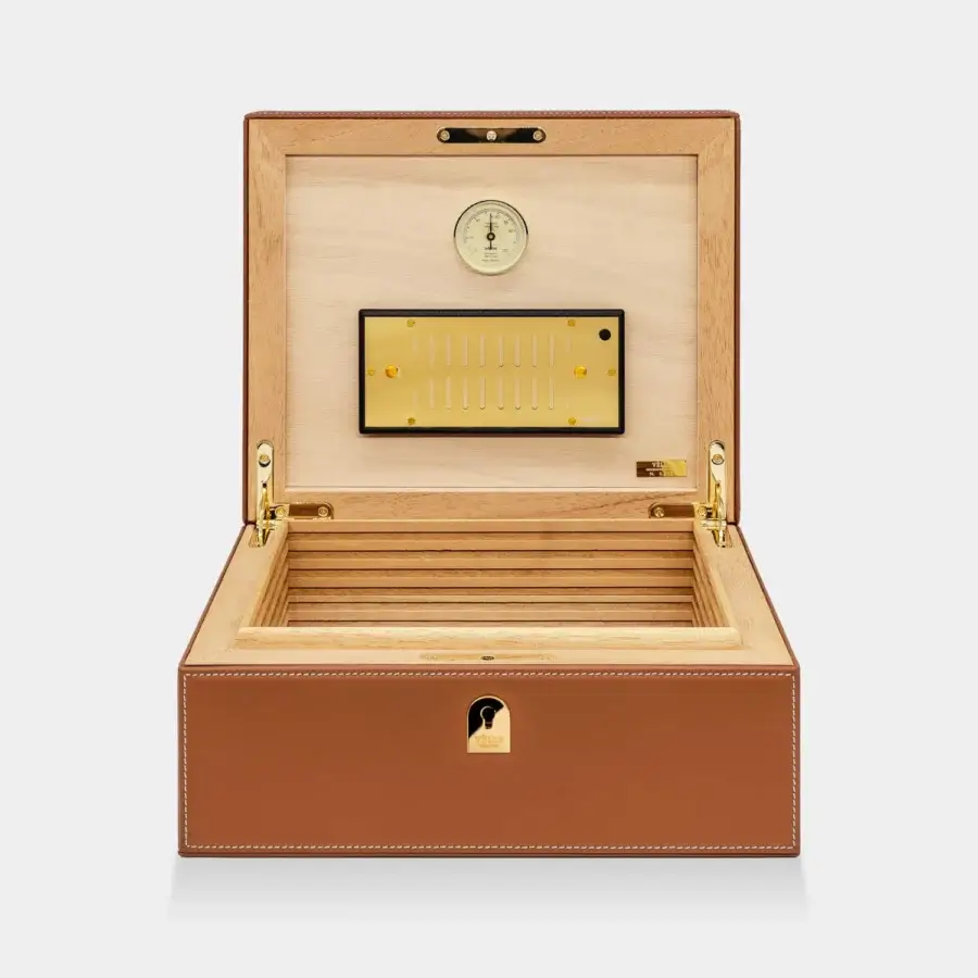Sophisticated Vèlle Milano Cigars Humidor in tan padded leather with contrast stitching and glossy gold toned hardware