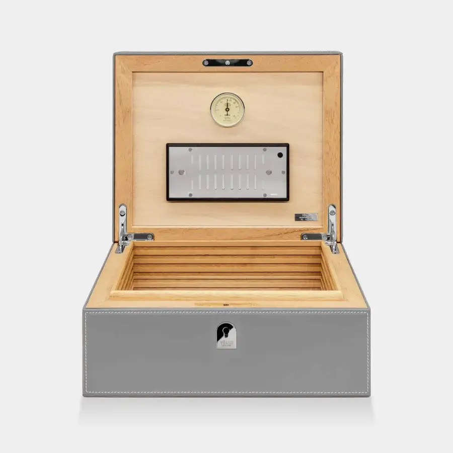 Impeccable Vèlle Milano cigars humidor in grey padded leather with white stitching and Spanish cedar interior hygrometer