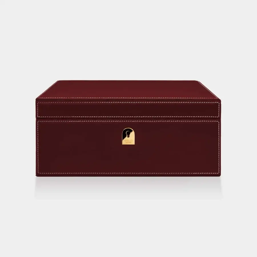 Sumptuous Vèlle Milano cigars humidor in deep burgundy padded leather with white contrast stitching and gold-toned metal plaque