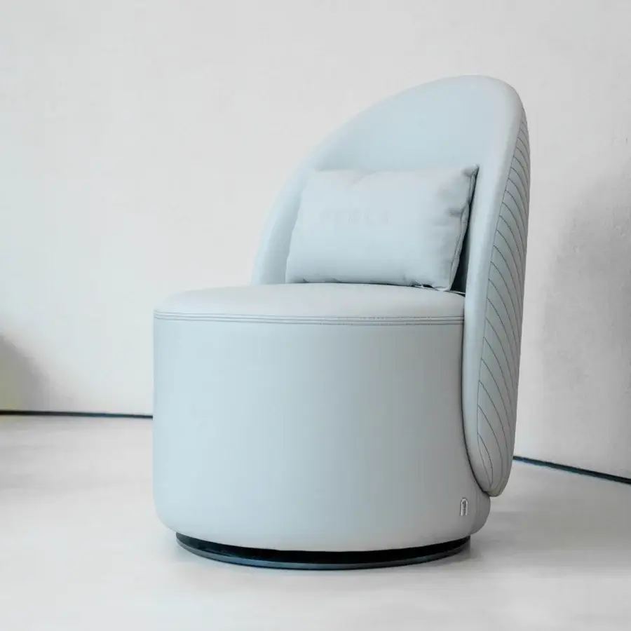 Distinguished Furla Casa Venus swivel lounge chair in light grey with pale blue undertones and matte black metal base