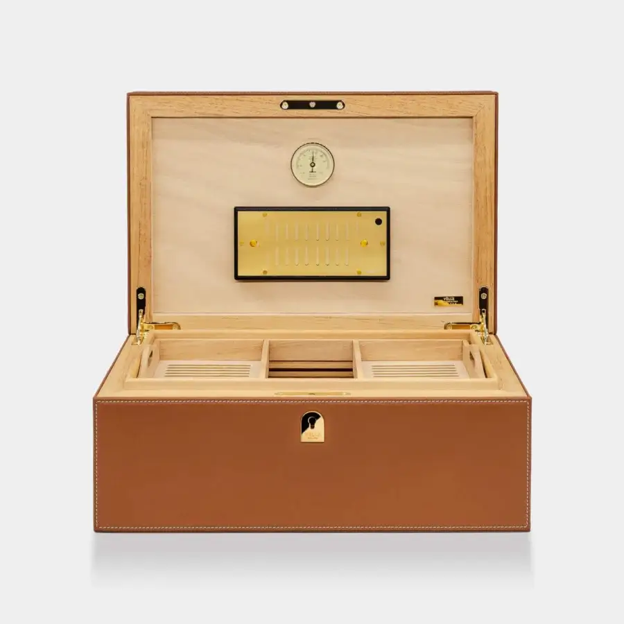 Exquisite Vèlle Milano Cigars Humidor Grand in tan padded leather with white stitching and gold-toned metal accents