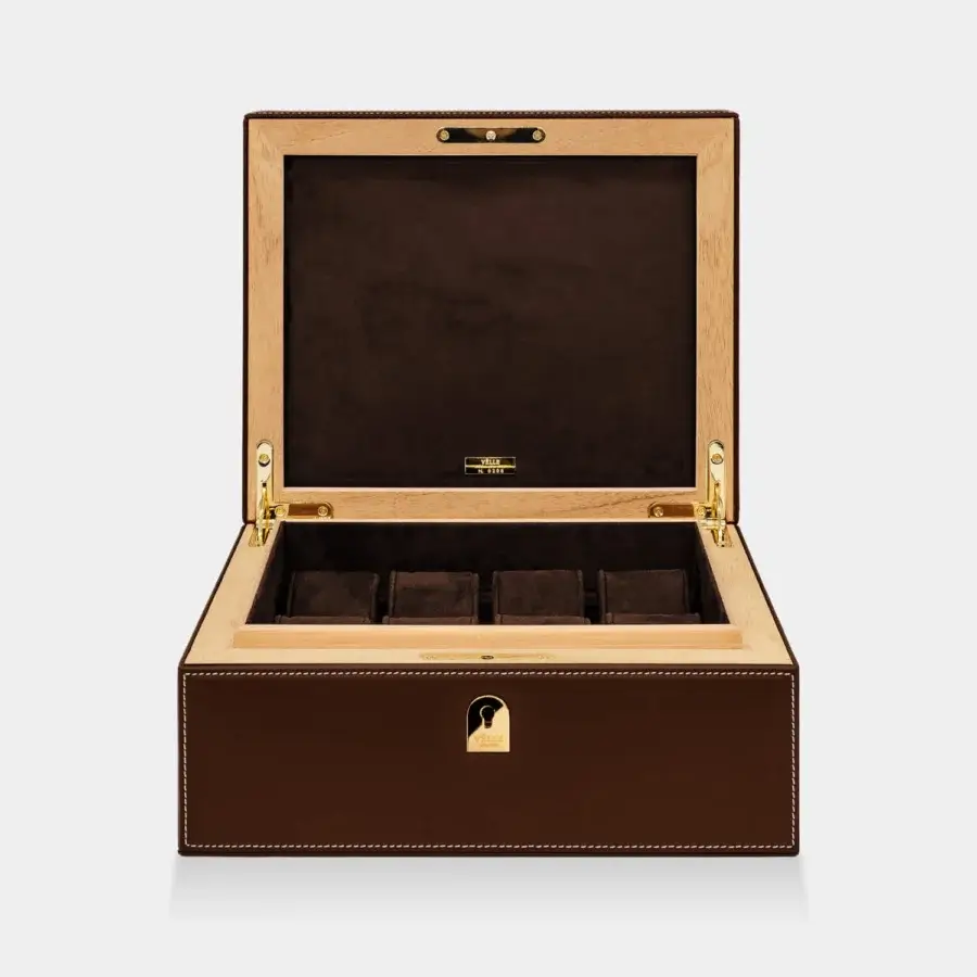 Distinguished Vèlle Milano watch case crafted from brown padded leather with white contrast stitching and gold toned hardware