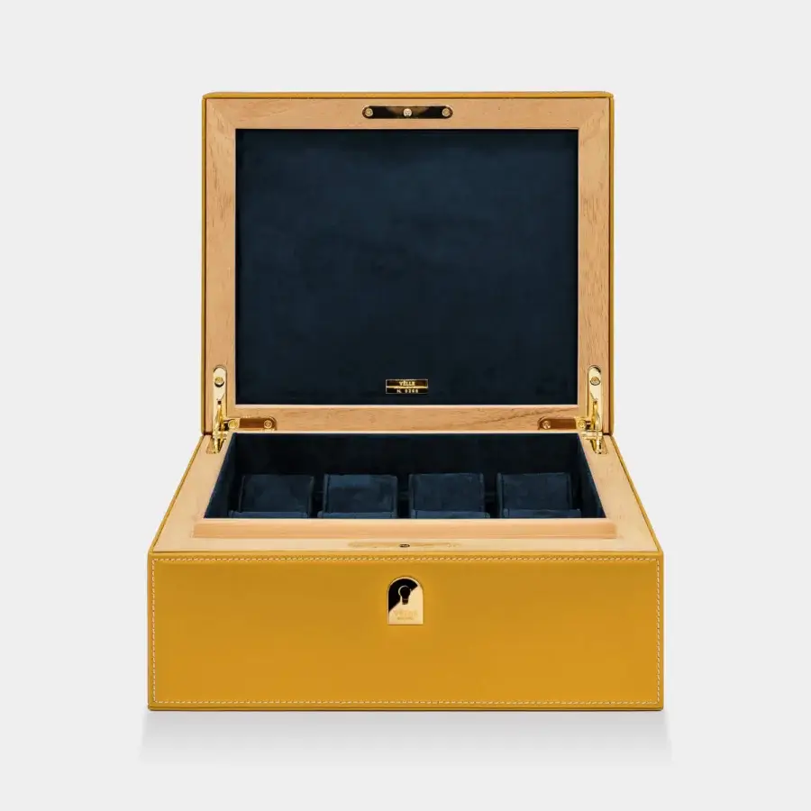 Exquisite Vèlle Milano watch case in mustard yellow padded leather with premium navy blue microfiber and natural wood frame