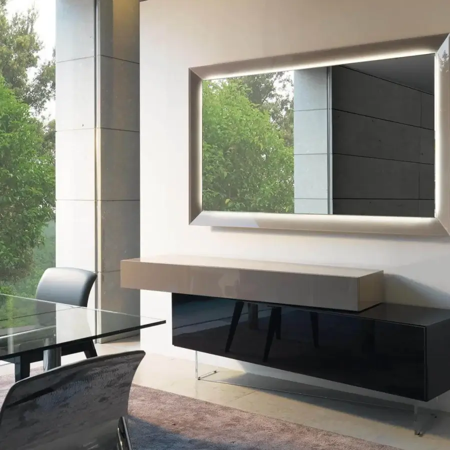 Elegant Reflex Prisma mirror with mirrored glass and light emanating from behind its rectangular silhouette with a glossy finish