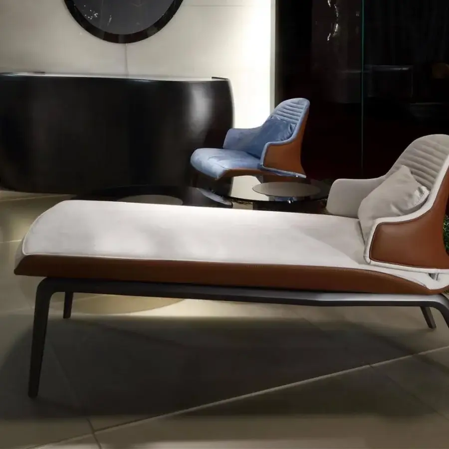 Distinguished Reflex Vela chaise lounge built in lacquered wood with resin and textile upholstery, brown leather trim, dark metal frame