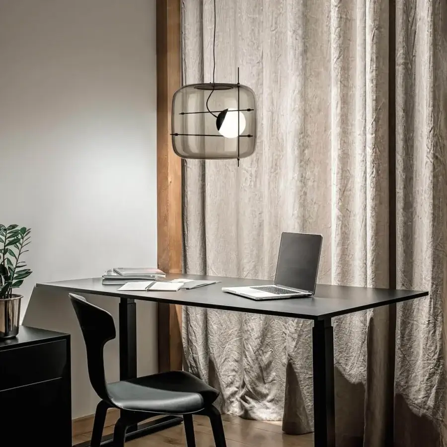Captivating Vistosi Plot suspension lamp with smoked glass enclosure and delicate black metal rods offering a soft glow