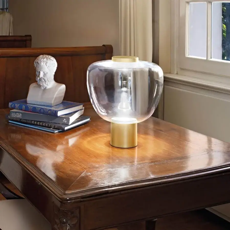 Distinguished Vistosi Riflesso lamp with a clear glass bubble and matte golden cylindrical metal base