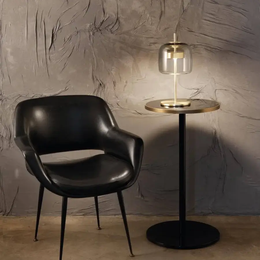 Captivating Vistosi Jube table lamp with transparent blown glass diffuser and glossy golden metal parts