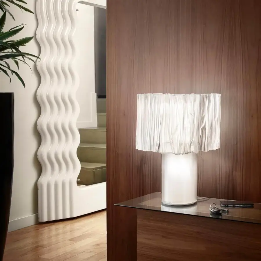 Exclusive Slamp Accordeon table lamp with a visually dynamic crinkled shade crafted in Lentiflex® with a soft white glow