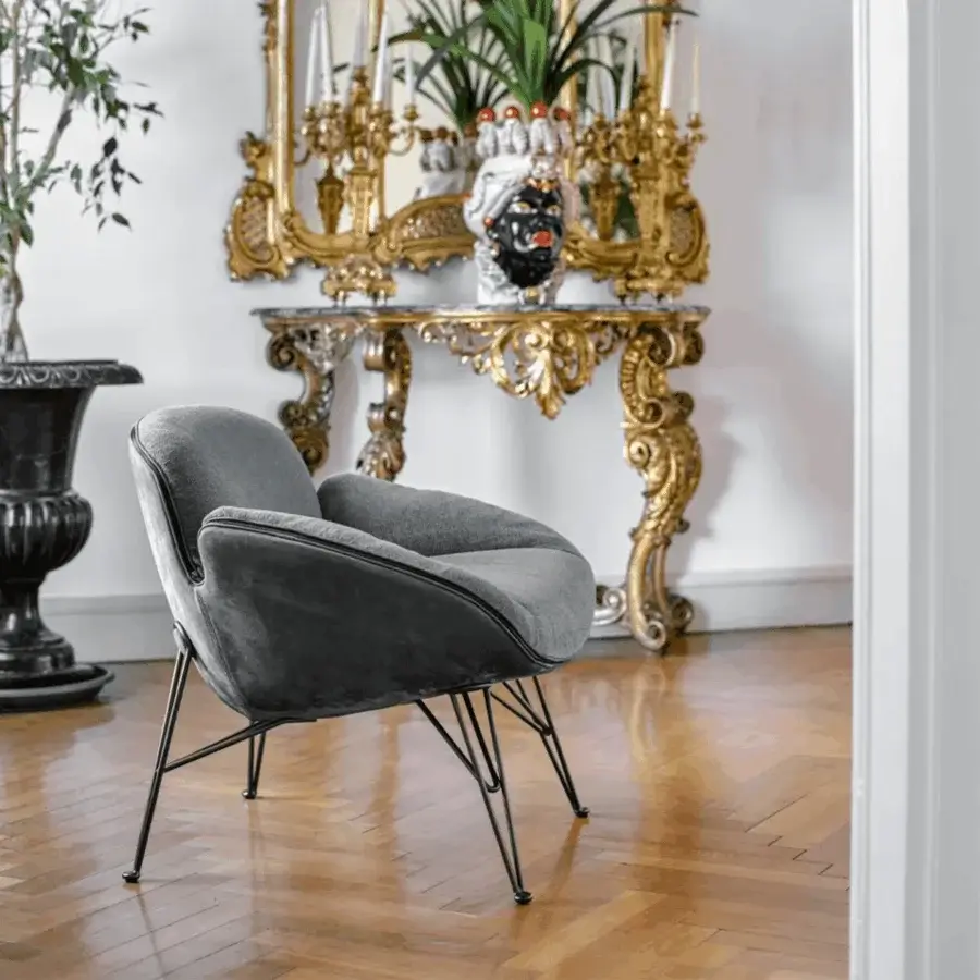 Sophisticated Arketipo Juno lounge chair in textured medium gray textile with matte dark metal feet