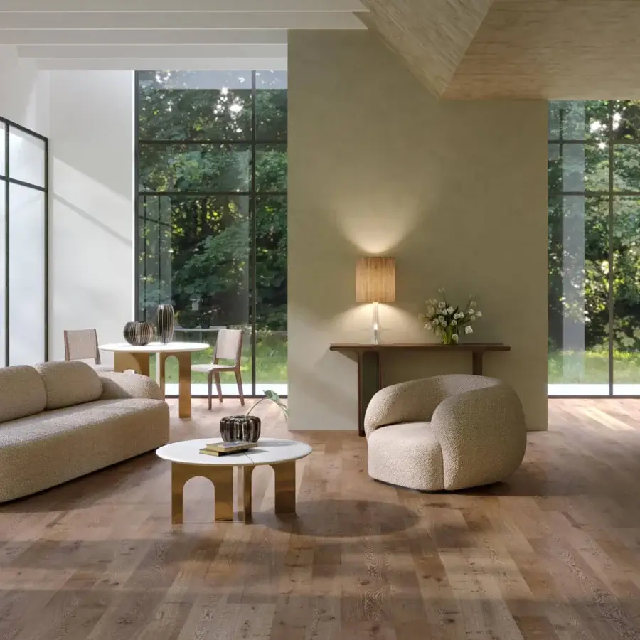 Sophisticated Paolo Castelli coffee table featuring cross-shaped champagne satin-finished metal base and white stone top