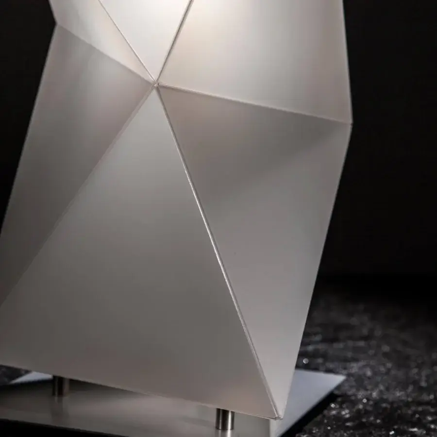 Exceptional Slamp Diamond floor lamp with a twisting sculptural shape crafted in translucent synthetic material with matte finish and silver base