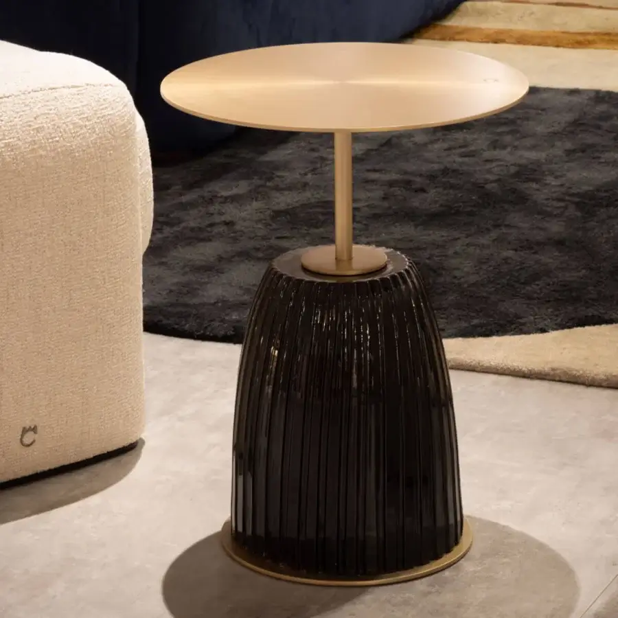 Luxury Paolo Castelli Dione side table with sculpted fluted ceramic base and sleek brushed matt gold metal top silhouette