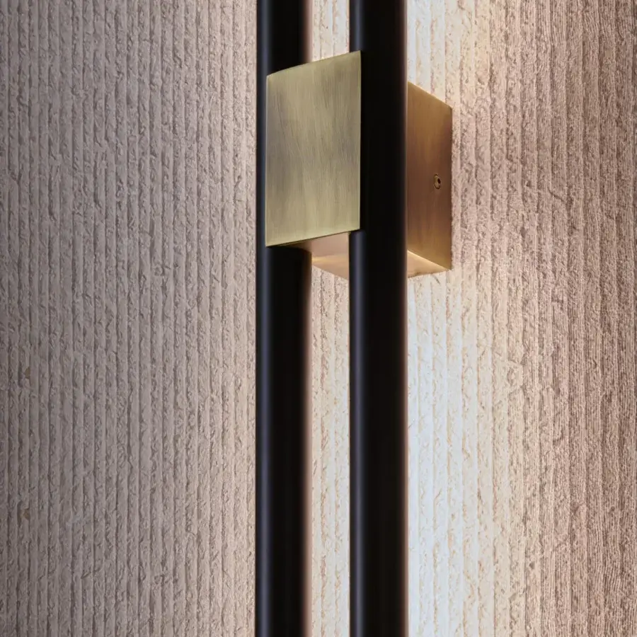 Luxury Paolo Castelli Fair wall lamp featuring matt black metal tracks, opal polycarbonate diffuser and bronze brass finish