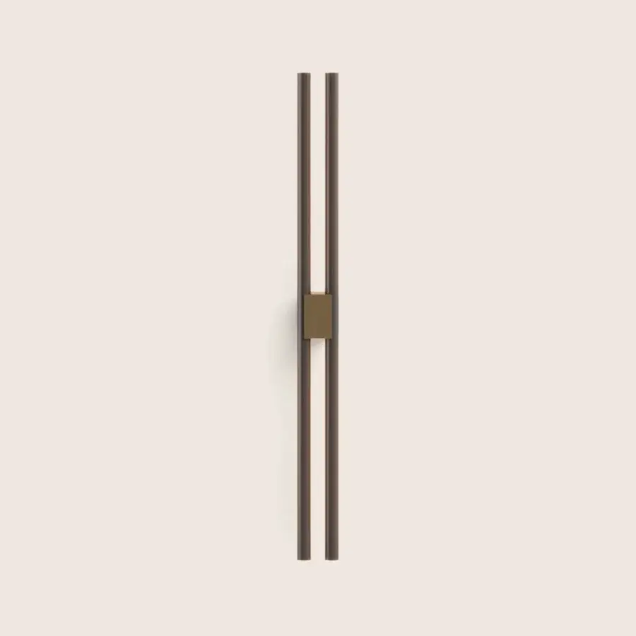 Exquisite Paolo Castelli Fair wall lamp featuring tubular metal and bronze brass mounting block